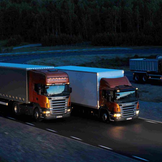 https://relyonshipping.com/wp-content/uploads/2015/09/Three-orange-Scania-trucks-540x540.jpg